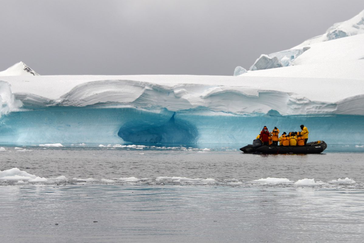 11D Zodiac Next To The Blue Ice Of A Glacier Cave In Paradise Harbour On Quark Expeditions Antarctica Cruise